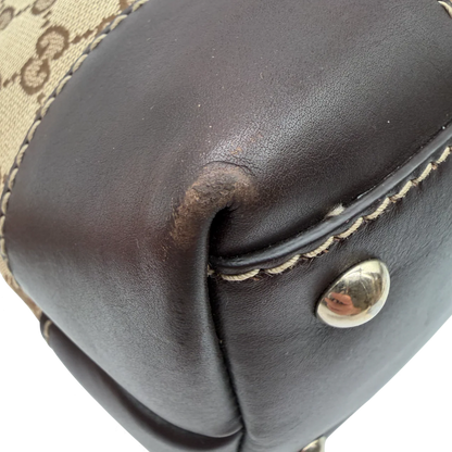 https://cdn.shopify.com/s/files/1/0564/9376/8855/files/Gucci_Handtasche_Lovely_Heart_braune_Lederdetails_monogram_beige_vintage_GG3226.webp?v=1764859389