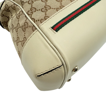 https://cdn.shopify.com/s/files/1/0564/9376/8855/files/Gucci_Handtasche_Mayfair_mit_Umhangegurt_Lederdetails_beige_monogram_beige_vintage_GG_0985.webp?v=1770899106