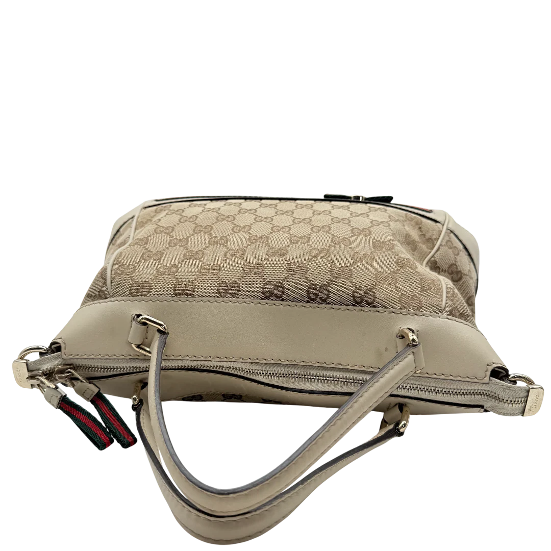 https://cdn.shopify.com/s/files/1/0564/9376/8855/files/Gucci_Handtasche_Mayfair_mit_Umhangegurt_Lederdetails_beige_monogram_beige_vintage_GG_0990.webp?v=1770899106