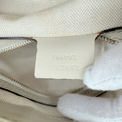 https://cdn.shopify.com/s/files/1/0564/9376/8855/files/Gucci_Handtasche_Mayfair_mit_Umhangegurt_Lederdetails_beige_monogram_beige_vintage_GG_0993.webp?v=1770899106