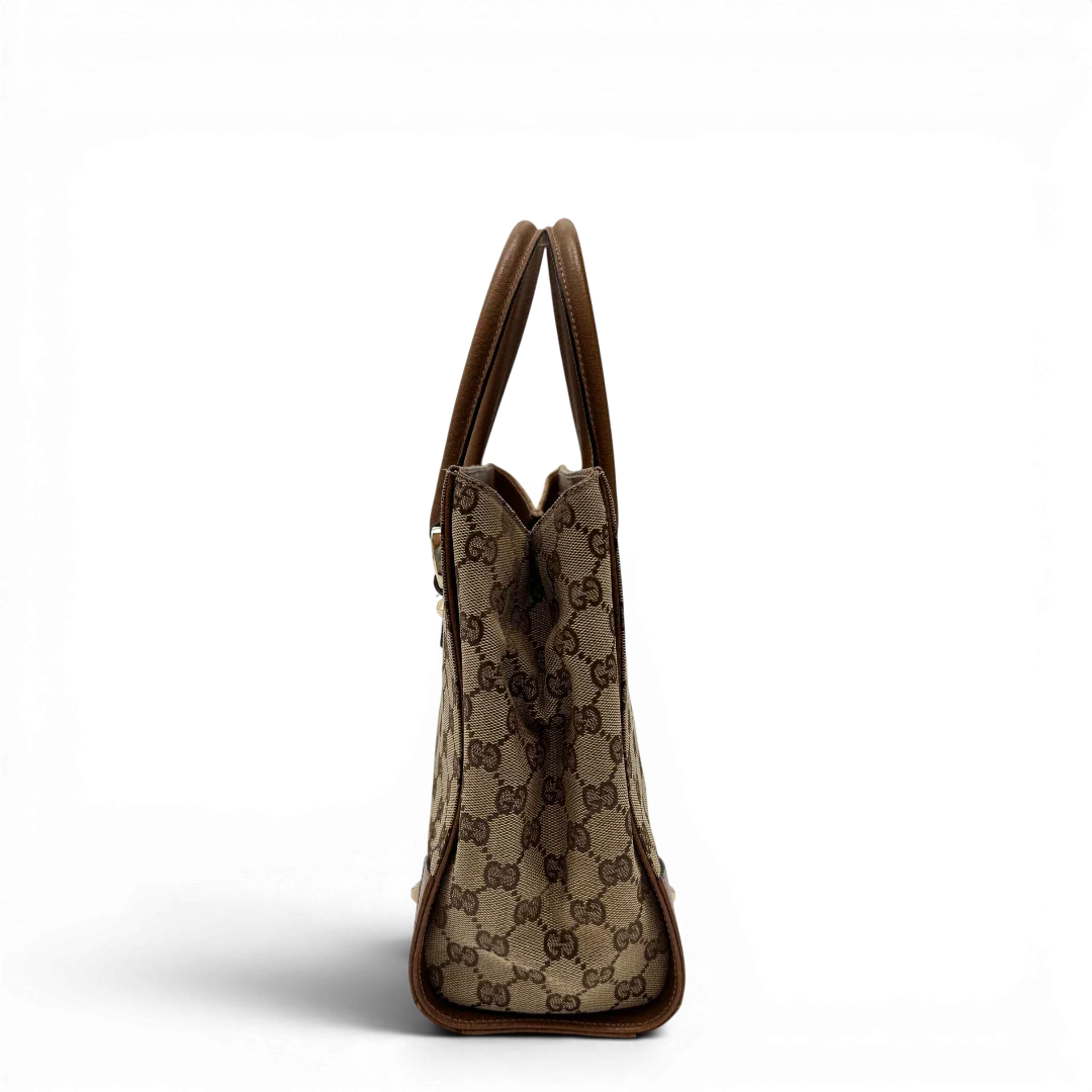 https://cdn.shopify.com/s/files/1/0564/9376/8855/files/Gucci_Handtasche_Nailhead_mini_Tote_monogram_beige_2.webp?v=1784244108
