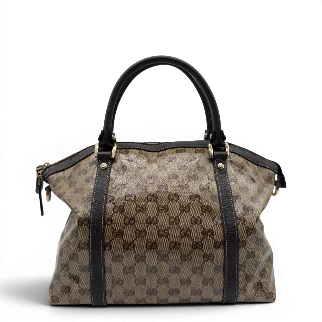 https://cdn.shopify.com/s/files/1/0564/9376/8855/files/Gucci_Handtasche_PVC_monogram_beige_vintage_GG7317.webp?v=1778680998