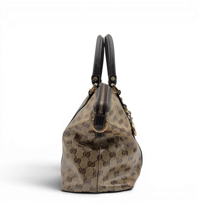 https://cdn.shopify.com/s/files/1/0564/9376/8855/files/Gucci_Handtasche_PVC_monogram_beige_vintage_GG7319.webp?v=1778680998