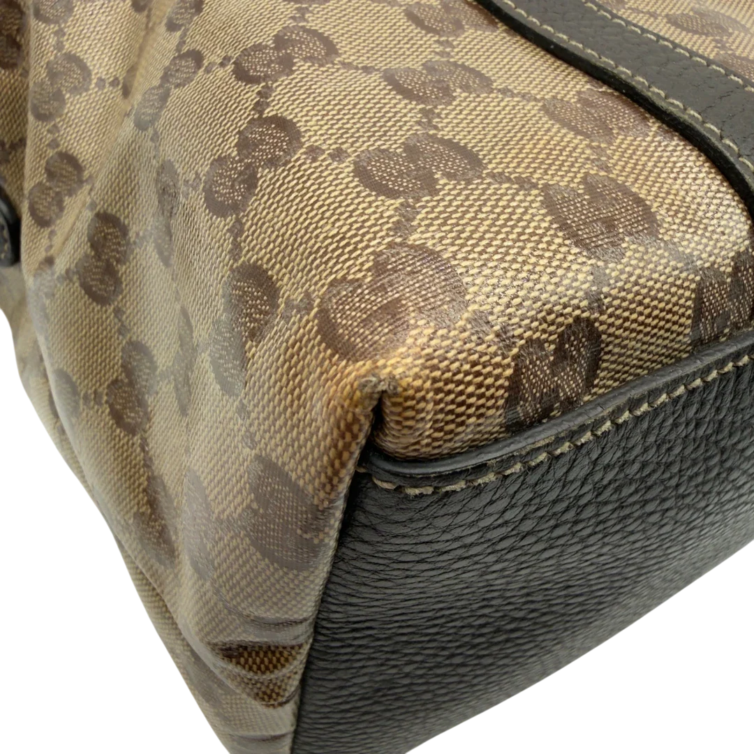 https://cdn.shopify.com/s/files/1/0564/9376/8855/files/Gucci_Handtasche_PVC_monogram_beige_vintage_GG7322.webp?v=1778680998