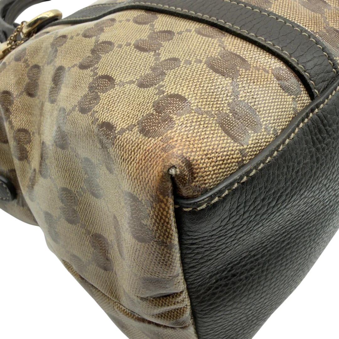 https://cdn.shopify.com/s/files/1/0564/9376/8855/files/Gucci_Handtasche_PVC_monogram_beige_vintage_GG7324.webp?v=1778680999