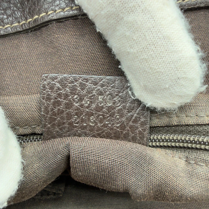 https://cdn.shopify.com/s/files/1/0564/9376/8855/files/Gucci_Handtasche_PVC_monogram_beige_vintage_GG7329.webp?v=1778680999