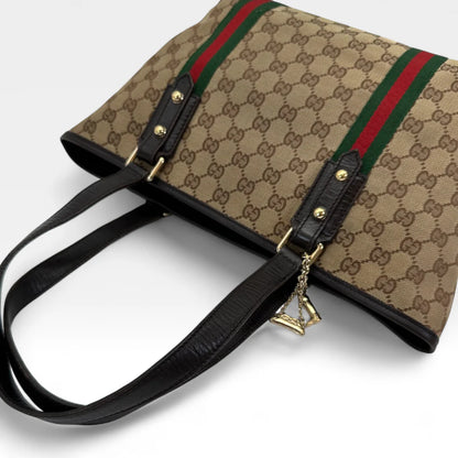 https://cdn.shopify.com/s/files/1/0564/9376/8855/files/Gucci_Handtasche_Shopper_Sherry_Line_monogram_beige_vintage_GG_handbag9847.webp?v=1761830891