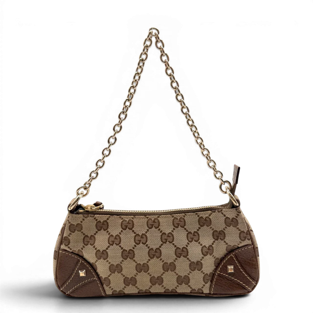 https://cdn.shopify.com/s/files/1/0564/9376/8855/files/Gucci_Handtasche_Soho_Leder_in_schwarz_mit_Nieten_Vintage_GG8262.webp?v=1781052191
