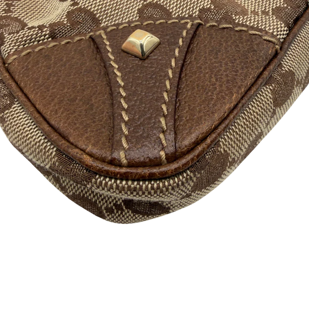 https://cdn.shopify.com/s/files/1/0564/9376/8855/files/Gucci_Handtasche_Soho_Leder_in_schwarz_mit_Nieten_Vintage_GG8269.webp?v=1781052191