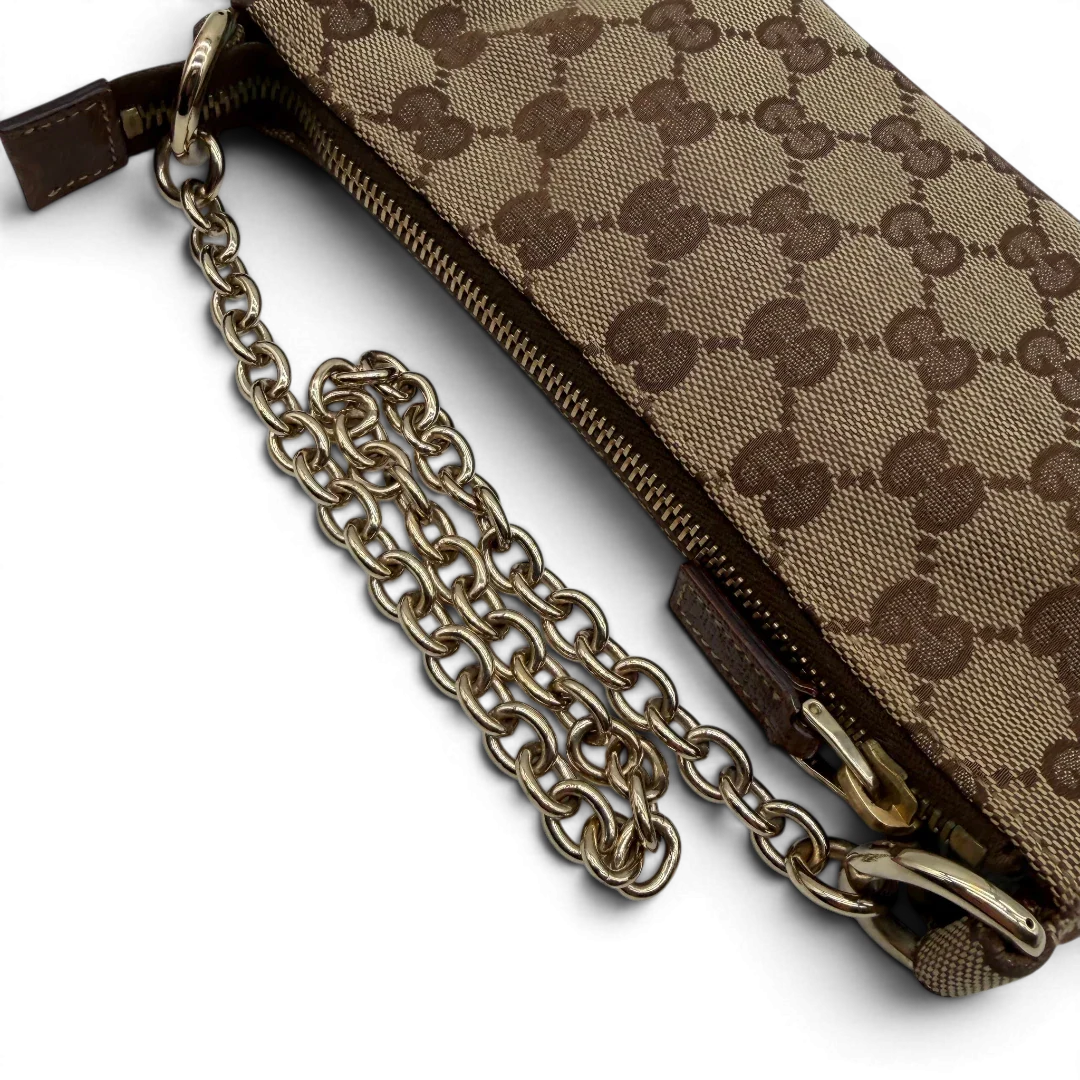 https://cdn.shopify.com/s/files/1/0564/9376/8855/files/Gucci_Handtasche_Soho_Leder_in_schwarz_mit_Nieten_Vintage_GG8273.webp?v=1781052191
