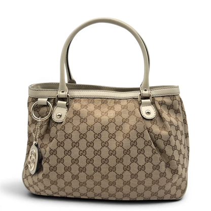 https://cdn.shopify.com/s/files/1/0564/9376/8855/files/Gucci_Handtasche_Sukey_Tote_Bag_monogram_beige_1.webp?v=1782908321