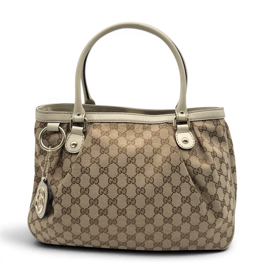 https://cdn.shopify.com/s/files/1/0564/9376/8855/files/Gucci_Handtasche_Sukey_Tote_Bag_monogram_beige_1.webp?v=1782908321