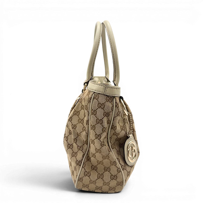 https://cdn.shopify.com/s/files/1/0564/9376/8855/files/Gucci_Handtasche_Sukey_Tote_Bag_monogram_beige_4.webp?v=1782908321