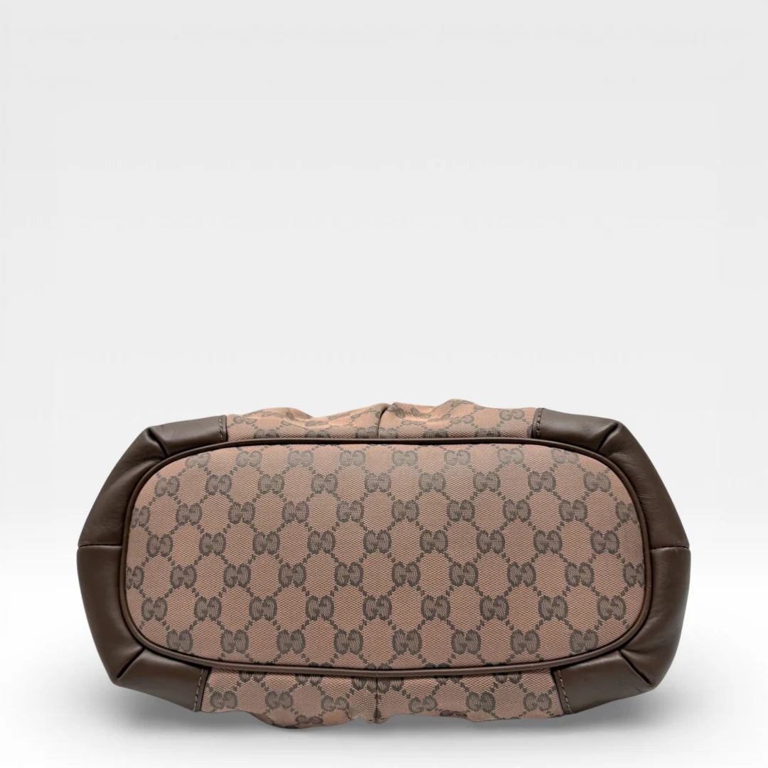 https://cdn.shopify.com/s/files/1/0564/9376/8855/files/Gucci_Handtasche_Sukey_mit_Umhaengegurt_monogram_braun_vintage_GG_8735.webp?v=1769118088