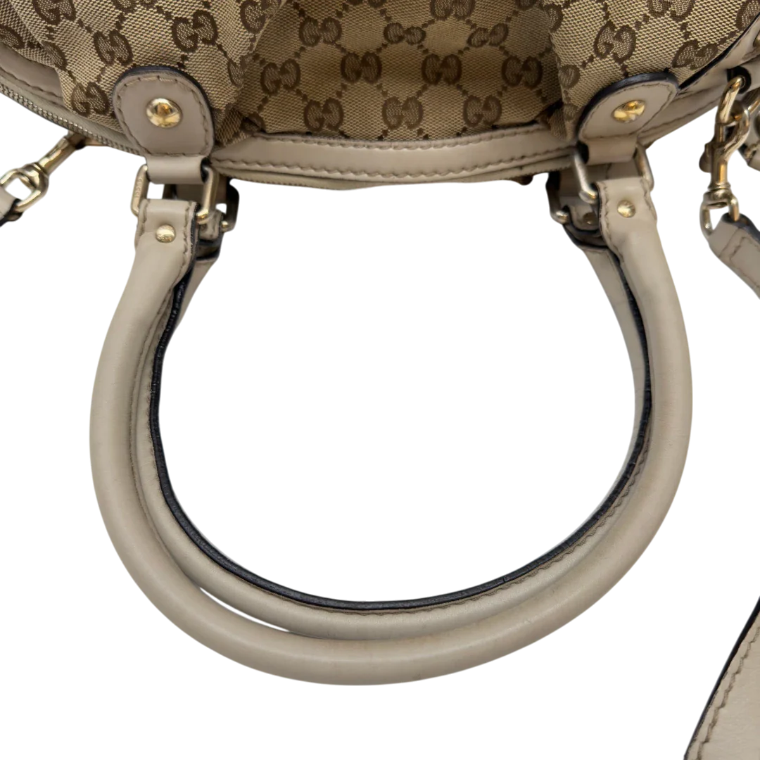 https://cdn.shopify.com/s/files/1/0564/9376/8855/files/Gucci_Handtasche_Sukey_mit_Umhangegurt_monogram_beige_10_74122c60-7ccd-4ae1-b8fd-a9c62376d250.webp?v=1783513326