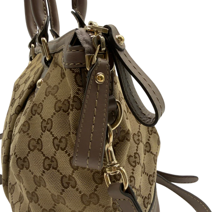 https://cdn.shopify.com/s/files/1/0564/9376/8855/files/Gucci_Handtasche_Sukey_mit_Umhangegurt_monogram_beige_12.webp?v=1782909395