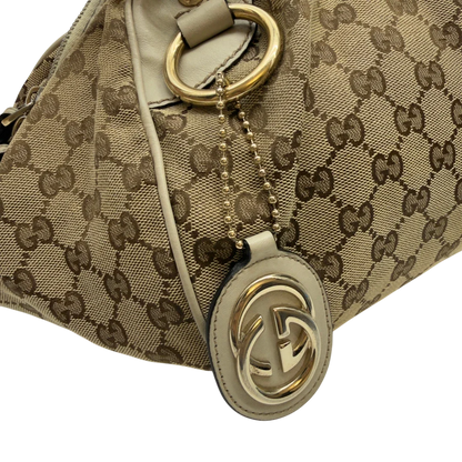 https://cdn.shopify.com/s/files/1/0564/9376/8855/files/Gucci_Handtasche_Sukey_mit_Umhangegurt_monogram_beige_12_b7bc3be3-cb1d-4745-bb4b-80ad702cc3e0.webp?v=1783513327