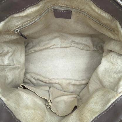 https://cdn.shopify.com/s/files/1/0564/9376/8855/files/Gucci_Handtasche_Sukey_mit_Umhangegurt_monogram_beige_13.webp?v=1782909395