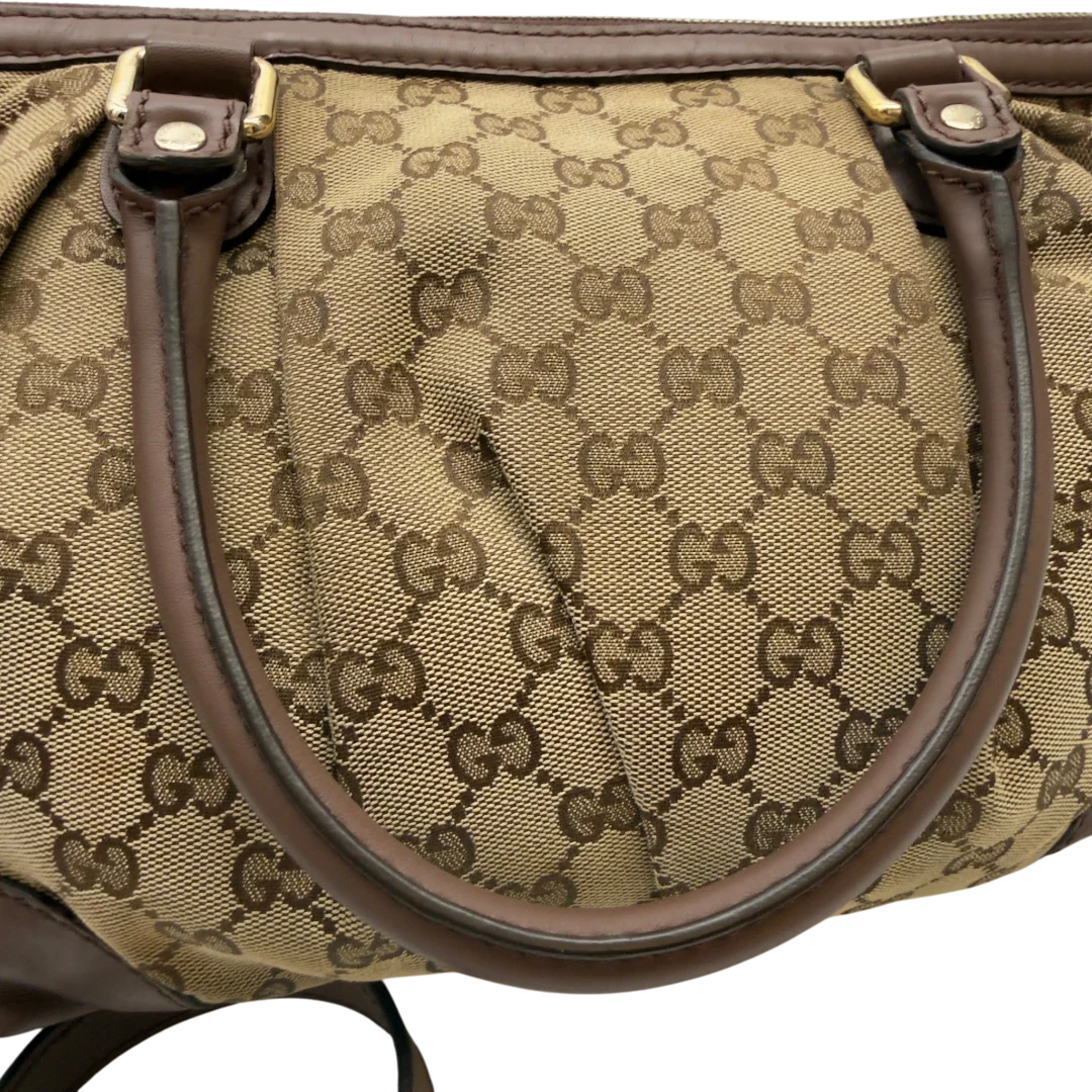 https://cdn.shopify.com/s/files/1/0564/9376/8855/files/Gucci_Handtasche_Sukey_mit_Umhangegurt_monogram_beige_14_aec128c8-44f7-4759-9738-5f1289decce3.webp?v=1783513164