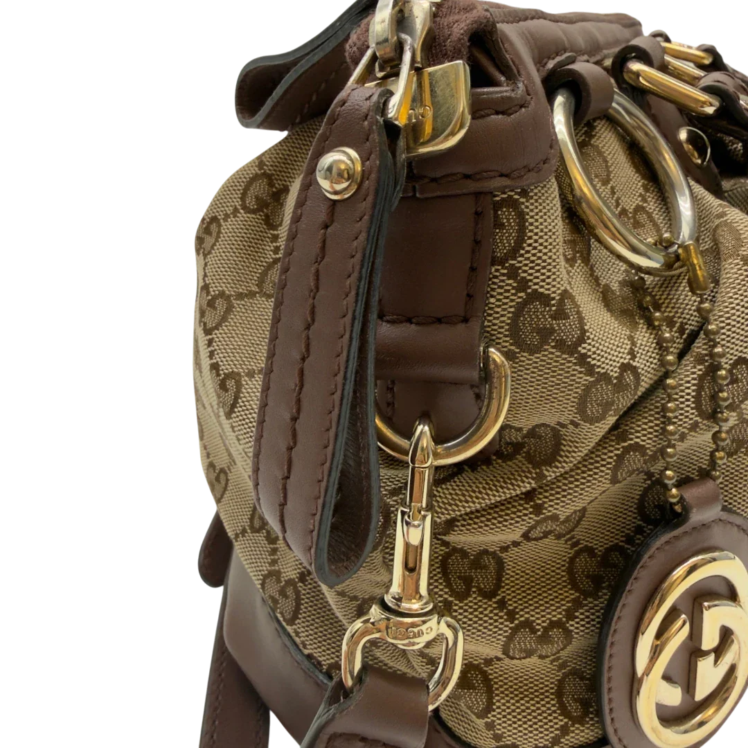 https://cdn.shopify.com/s/files/1/0564/9376/8855/files/Gucci_Handtasche_Sukey_mit_Umhangegurt_monogram_beige_18_90866cd2-63e9-41e9-8783-cae13ab7bdd8.webp?v=1783513163
