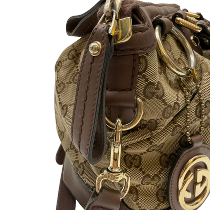 https://cdn.shopify.com/s/files/1/0564/9376/8855/files/Gucci_Handtasche_Sukey_mit_Umhangegurt_monogram_beige_18_90866cd2-63e9-41e9-8783-cae13ab7bdd8.webp?v=1783513163