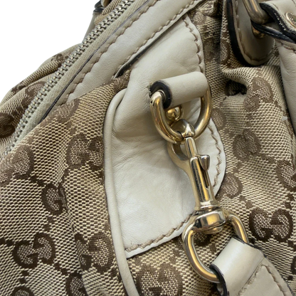https://cdn.shopify.com/s/files/1/0564/9376/8855/files/Gucci_Handtasche_Sukey_mit_Umhangegurt_monogram_beige_18_baca7ec3-2c2d-479d-a590-59977ac74d79.webp?v=1783513327