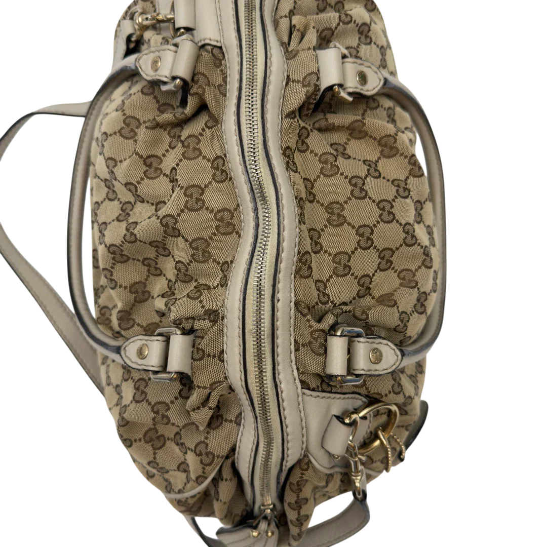 https://cdn.shopify.com/s/files/1/0564/9376/8855/files/Gucci_Handtasche_Sukey_mit_Umhangegurt_monogram_beige_19.webp?v=1783513327
