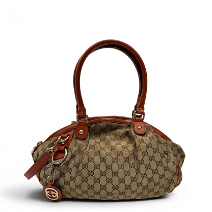 https://cdn.shopify.com/s/files/1/0564/9376/8855/files/Gucci_Handtasche_Sukey_mit_Umhangegurt_monogram_beige_1_0d3b643f-b7d7-4be2-b7da-d62df6a5cb39.webp?v=1784248098