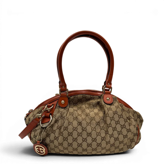 https://cdn.shopify.com/s/files/1/0564/9376/8855/files/Gucci_Handtasche_Sukey_mit_Umhangegurt_monogram_beige_1_0d3b643f-b7d7-4be2-b7da-d62df6a5cb39.webp?v=1784248098