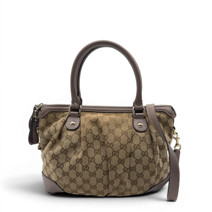 https://cdn.shopify.com/s/files/1/0564/9376/8855/files/Gucci_Handtasche_Sukey_mit_Umhangegurt_monogram_beige_2.webp?v=1782909395