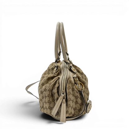 https://cdn.shopify.com/s/files/1/0564/9376/8855/files/Gucci_Handtasche_Sukey_mit_Umhangegurt_monogram_beige_2_19ce3414-ea12-4c2b-83d1-9b0126046b51.webp?v=1783513326