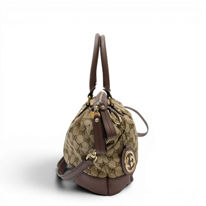 https://cdn.shopify.com/s/files/1/0564/9376/8855/files/Gucci_Handtasche_Sukey_mit_Umhangegurt_monogram_beige_2_9c38092c-e9e6-49a1-bacf-ee043d7b158e.webp?v=1783513163