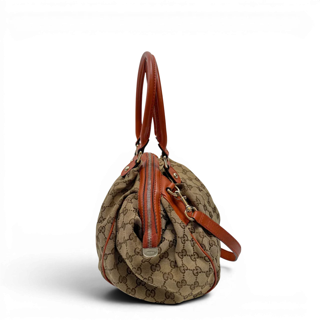 https://cdn.shopify.com/s/files/1/0564/9376/8855/files/Gucci_Handtasche_Sukey_mit_Umhangegurt_monogram_beige_3_1b81a7d7-d9ae-420a-b13b-aa3b29552bb3.webp?v=1784248098