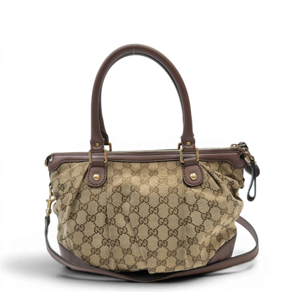 https://cdn.shopify.com/s/files/1/0564/9376/8855/files/Gucci_Handtasche_Sukey_mit_Umhangegurt_monogram_beige_4_d5fe5c6b-4354-49c7-8334-22050cbd8885.webp?v=1783513163