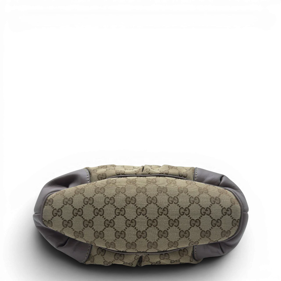 https://cdn.shopify.com/s/files/1/0564/9376/8855/files/Gucci_Handtasche_Sukey_mit_Umhangegurt_monogram_beige_5.webp?v=1782909395