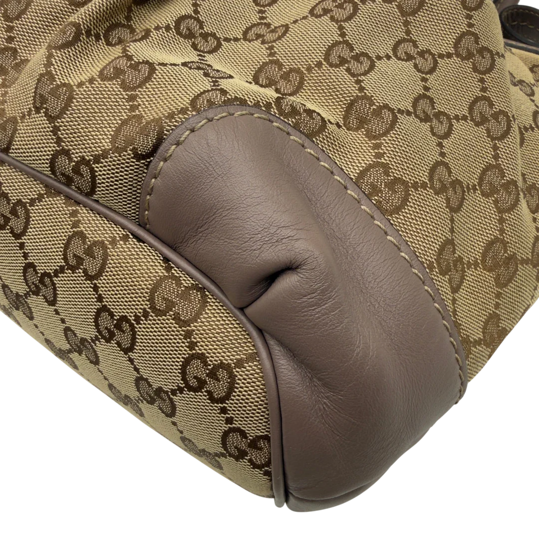 https://cdn.shopify.com/s/files/1/0564/9376/8855/files/Gucci_Handtasche_Sukey_mit_Umhangegurt_monogram_beige_6.webp?v=1782909395
