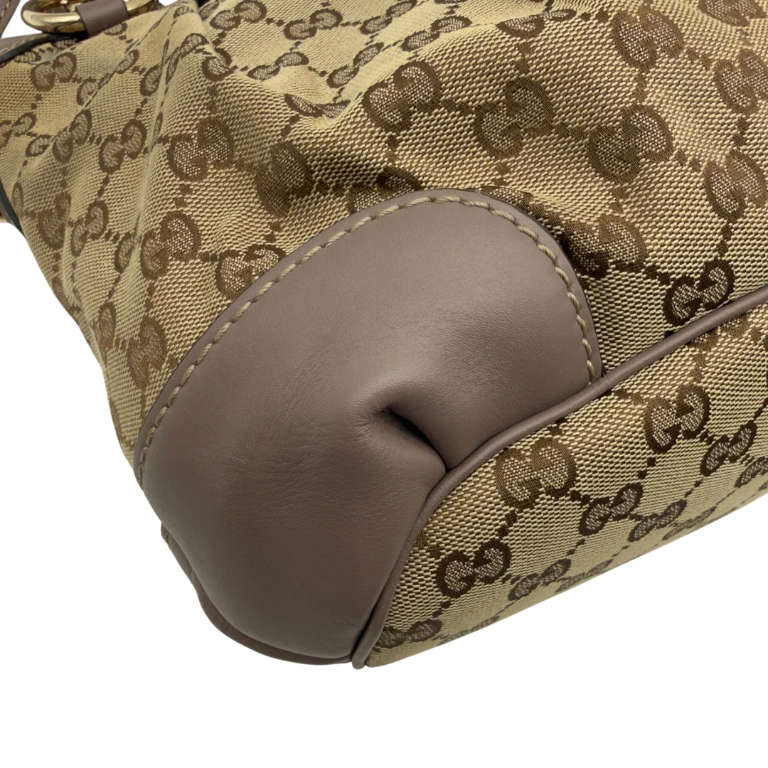 https://cdn.shopify.com/s/files/1/0564/9376/8855/files/Gucci_Handtasche_Sukey_mit_Umhangegurt_monogram_beige_7.webp?v=1782909395