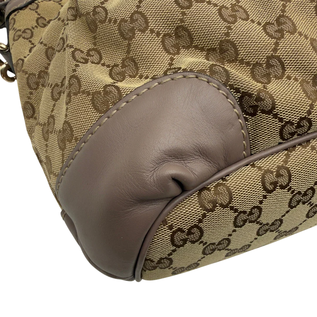 https://cdn.shopify.com/s/files/1/0564/9376/8855/files/Gucci_Handtasche_Sukey_mit_Umhangegurt_monogram_beige_9.webp?v=1782909396