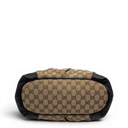 https://cdn.shopify.com/s/files/1/0564/9376/8855/files/Gucci_Handtasche_Sukey_mit_Umhangegurt_monogram_beige_vintage_GG2328.webp?v=1779968392