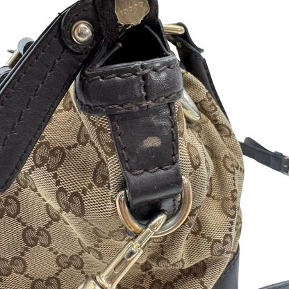 https://cdn.shopify.com/s/files/1/0564/9376/8855/files/Gucci_Handtasche_Sukey_mit_Umhangegurt_monogram_beige_vintage_GG2340.webp?v=1779968393