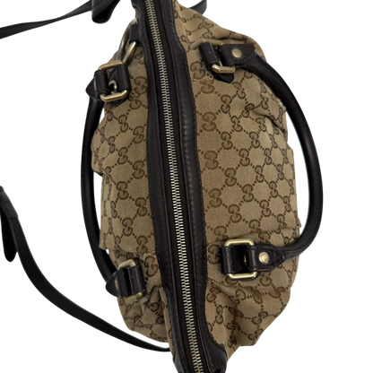 https://cdn.shopify.com/s/files/1/0564/9376/8855/files/Gucci_Handtasche_Sukey_mit_Umhangegurt_monogram_beige_vintage_GG2341.webp?v=1779968392