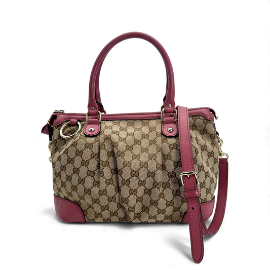 https://cdn.shopify.com/s/files/1/0564/9376/8855/files/Gucci_Handtasche_Sukey_mit_Umhangegurt_monogram_beige_vintage_GG_handbag0686.webp?v=1764856794