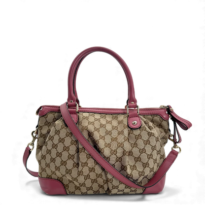 https://cdn.shopify.com/s/files/1/0564/9376/8855/files/Gucci_Handtasche_Sukey_mit_Umhangegurt_monogram_beige_vintage_GG_handbag0687.webp?v=1764856838