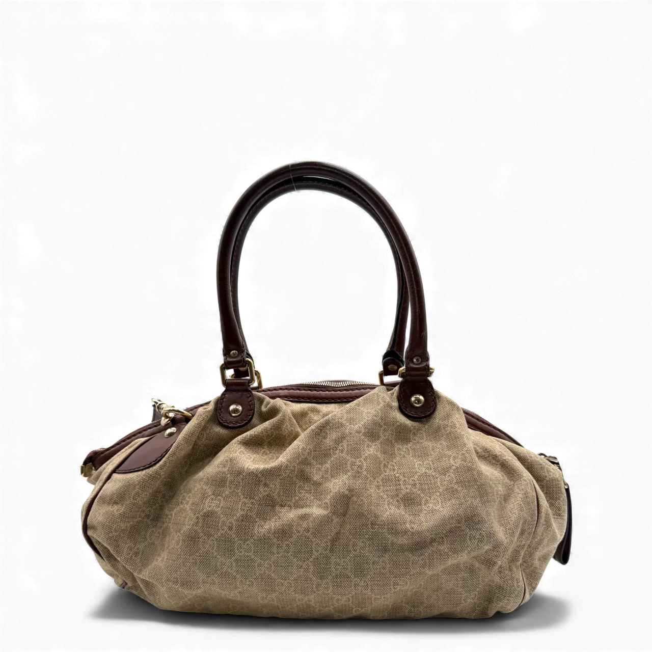 https://cdn.shopify.com/s/files/1/0564/9376/8855/files/Gucci_Handtasche_Sukey_mit_Umhangegurt_monogram_beige_vintage_GG_handbag3041.webp?v=1764854636