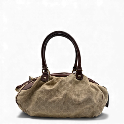 https://cdn.shopify.com/s/files/1/0564/9376/8855/files/Gucci_Handtasche_Sukey_mit_Umhangegurt_monogram_beige_vintage_GG_handbag3041.webp?v=1764854636