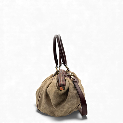 https://cdn.shopify.com/s/files/1/0564/9376/8855/files/Gucci_Handtasche_Sukey_mit_Umhangegurt_monogram_beige_vintage_GG_handbag3044.webp?v=1764854636