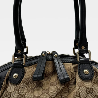 https://cdn.shopify.com/s/files/1/0564/9376/8855/files/Gucci_Handtasche_Sukey_mit_Umhangegurt_monogram_beige_vintage_GG_handbag4628.webp?v=1764897302