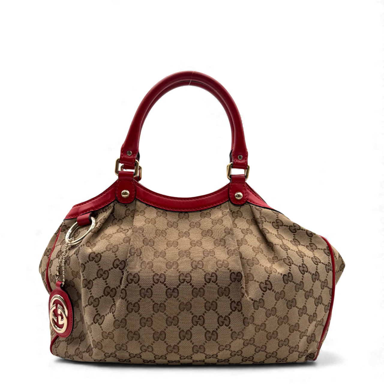 https://cdn.shopify.com/s/files/1/0564/9376/8855/files/Gucci_Handtasche_Sukey_rote_Lederdetails_monogram_beige_vintage_GG_handbag3263.webp?v=1764858963