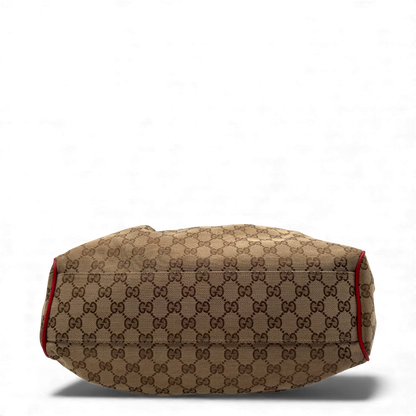 https://cdn.shopify.com/s/files/1/0564/9376/8855/files/Gucci_Handtasche_Sukey_rote_Lederdetails_monogram_beige_vintage_GG_handbag3271.webp?v=1764858987