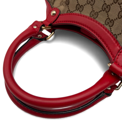 https://cdn.shopify.com/s/files/1/0564/9376/8855/files/Gucci_Handtasche_Sukey_rote_Lederdetails_monogram_beige_vintage_GG_handbag3277.webp?v=1764858987